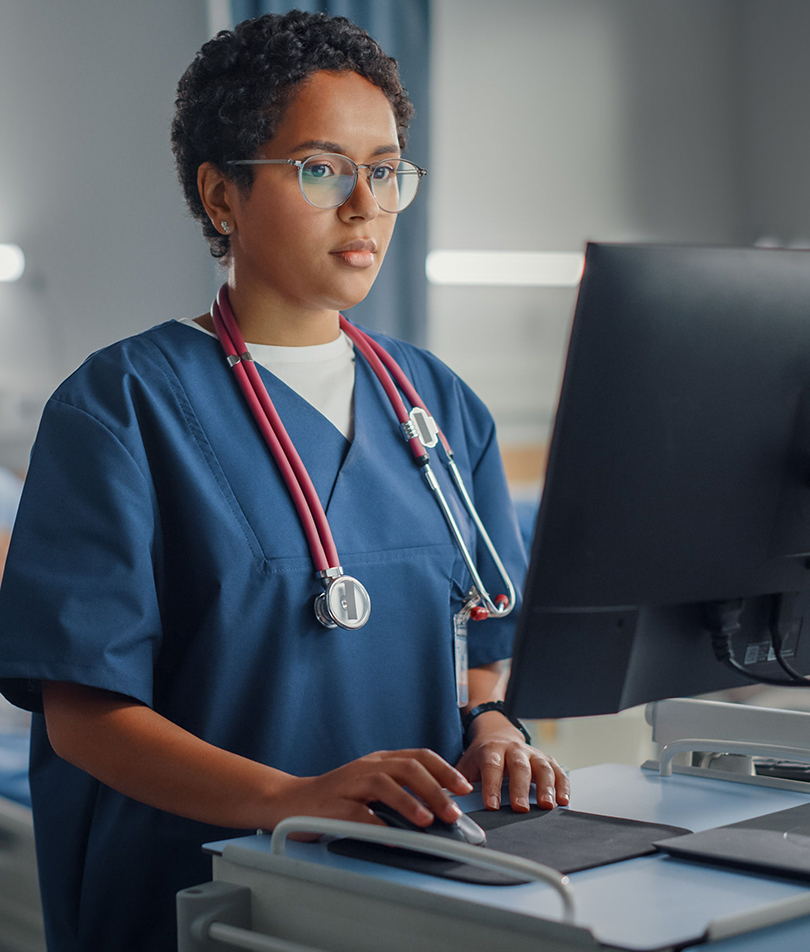 woman-standing-at-computer